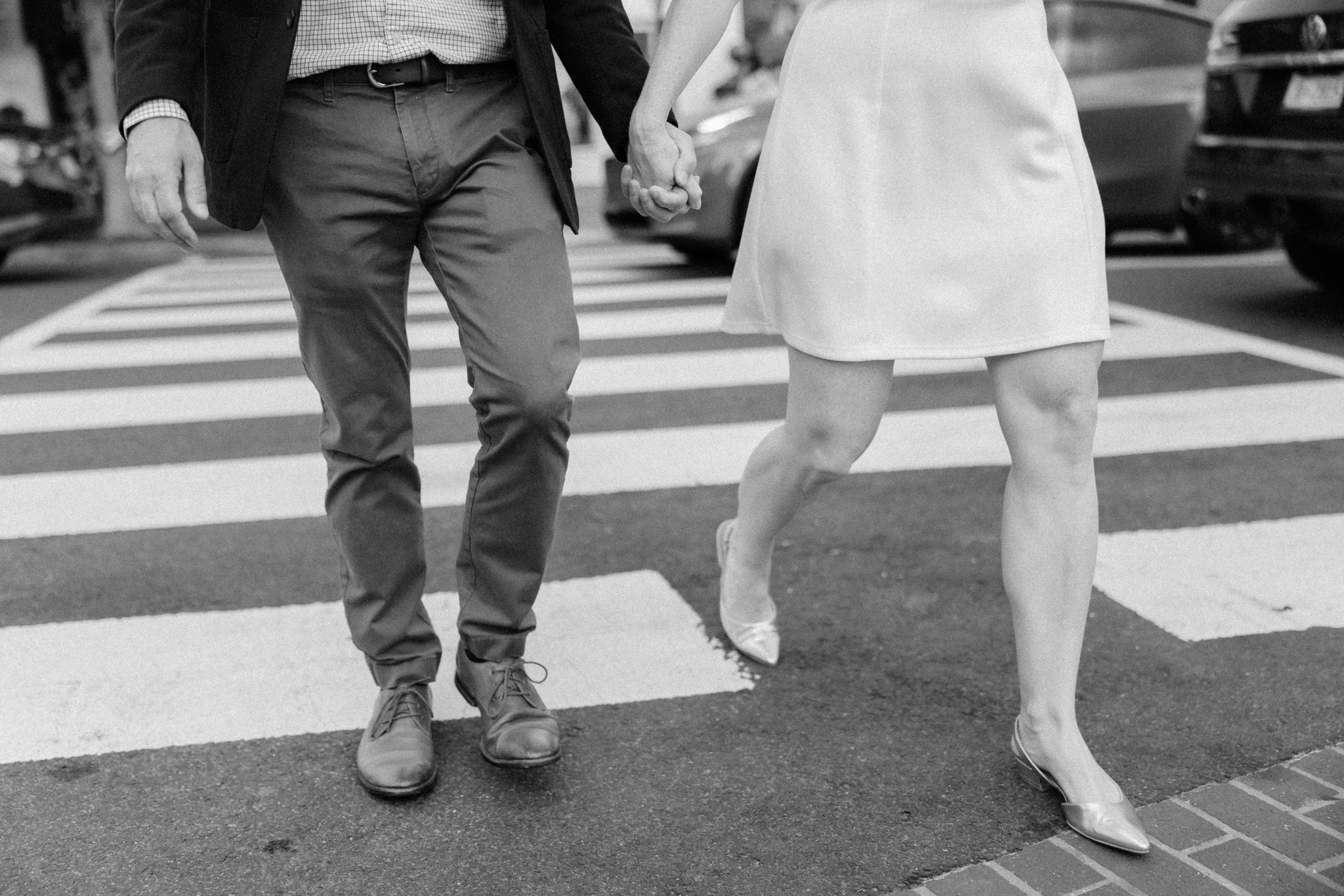 close up of couple's feet walking through the streets of Washington, D.C.