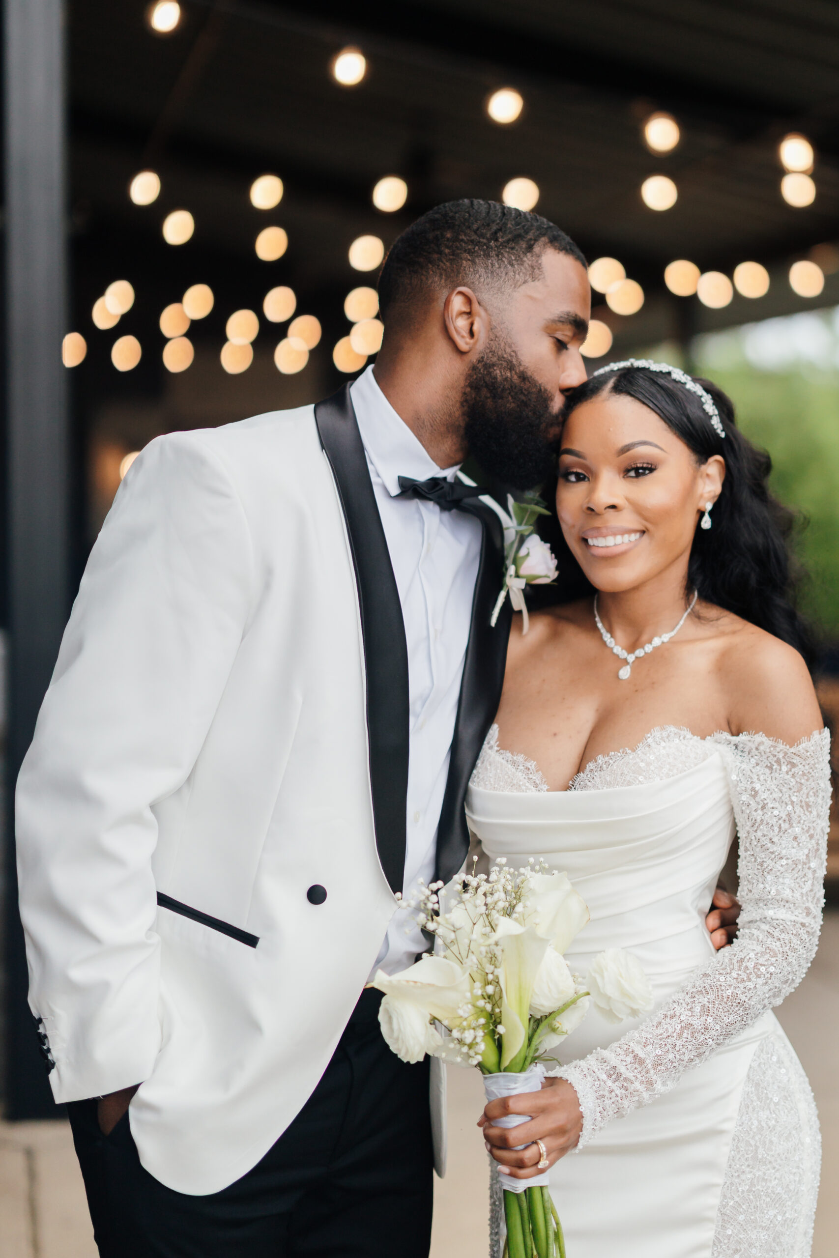 Groom kissing bride on the forehead for a wedding photo Northern Virginia Wedding