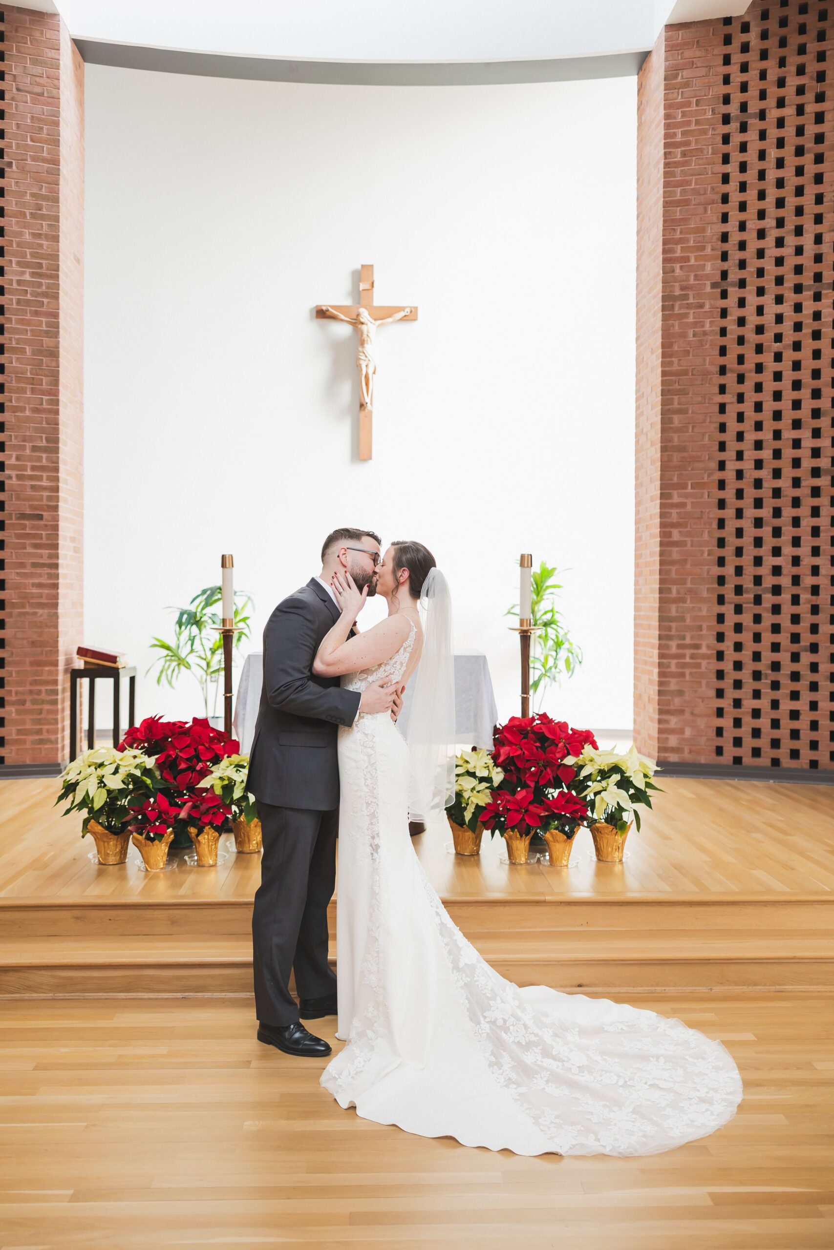couple kissing after getting married at church in vienna virginia
